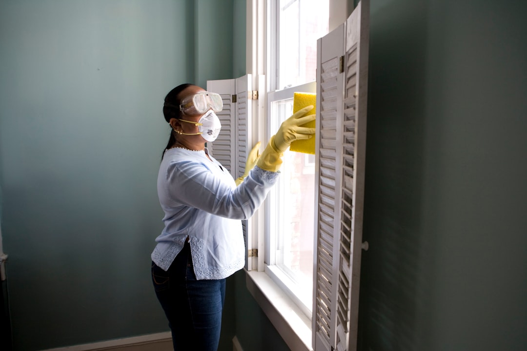 our-stories When renovating a home, you should use a damp sponge or cloth to clean dust collected on a window sill, as the dust may contain asbestos or lead-based paint. Home maintenance is an ongoing process for any homeowner, and here we see an African- American woman who’d taken a damp sponge to her window’s frame, in order to remove accumulated dust particulates. Note how the homeowner had donned a pair of waterproof gloves, a facemask, and a pair of goggles, prior to beginning this task.
